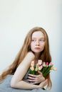 Girl Holding Bunch of Tulips
