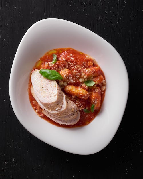 Pasta with Tomato Sauce with Slices of White Cheese