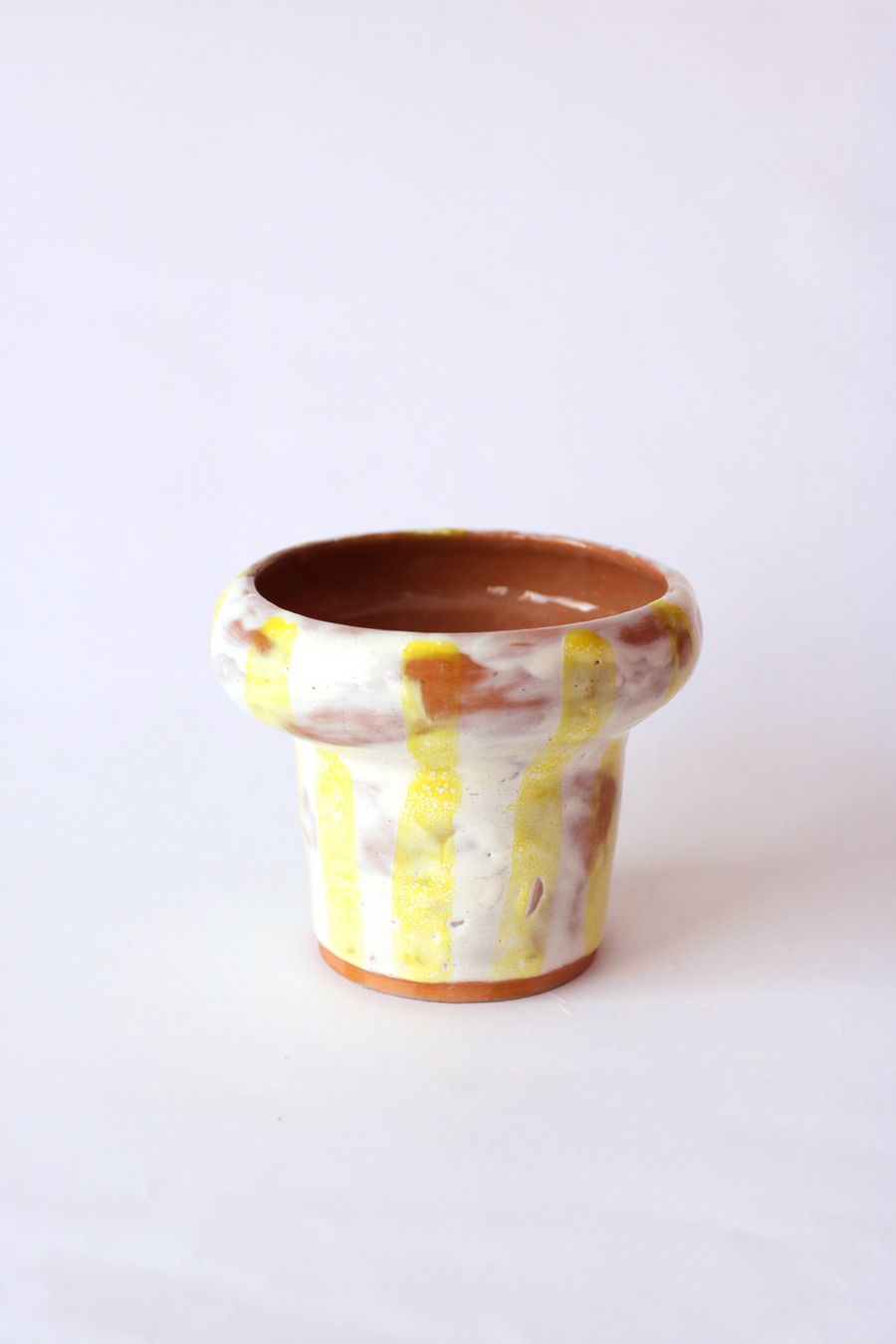 Three small hand-painted ceramic pots