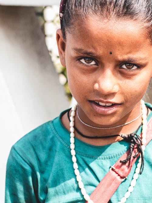 Free Portrait of a Girl in a Green Shirt Stock Photo