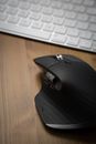 Black Cordless Computer Mouse on Gray Laptop Computer