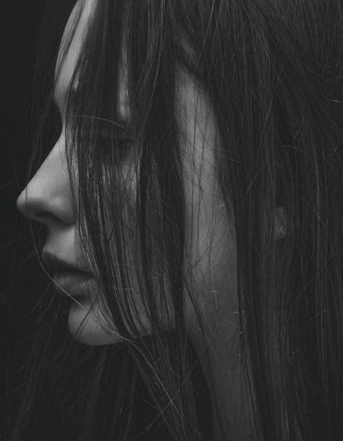 Free Grayscale Photo of hair partially covering girl's face Stock Photo