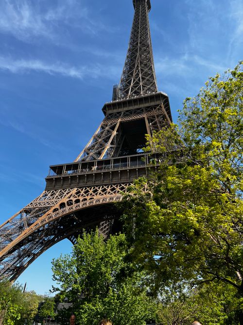 Free Striking low angle shot of the Eiffel Tower against a clear blue sky in Paris. Stock Photo