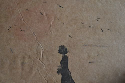 Free Artistic image of a woman's silhouette with birds on a textured wall, conveying solitude. Stock Photo