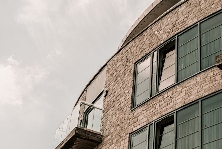 Photograph Of A Balcony Near Windows