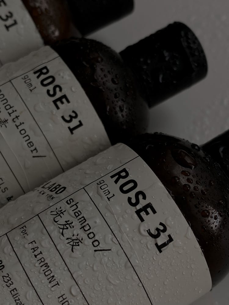 Grayscale Photo Of Labeled Bottles