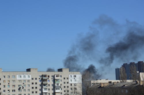 Free There is black smoke from a rocket or bomb explosion in a city during a war Stock Photo