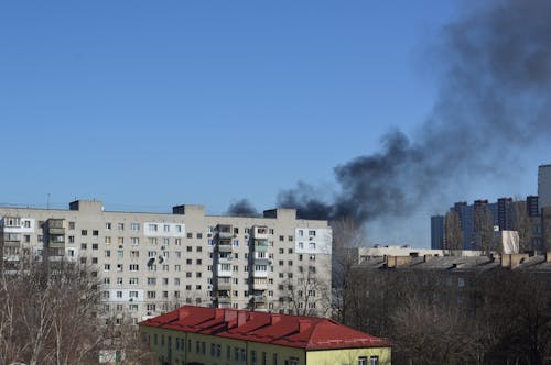 Free There is black smoke from a rocket or bomb explosion in a city during a war Stock Photo