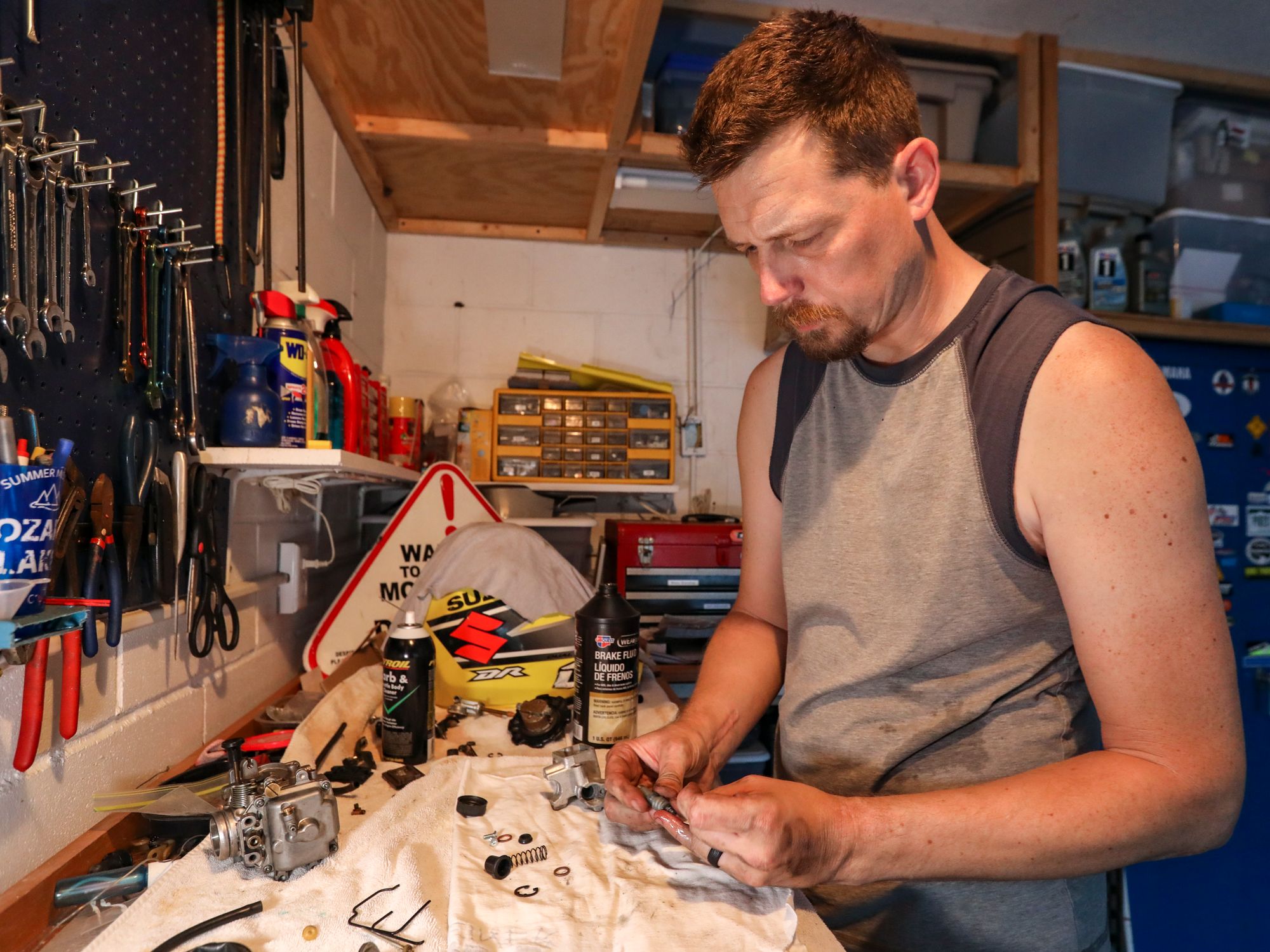 Guy Using Tools A Man Holding a Tool · Free Stock Photo