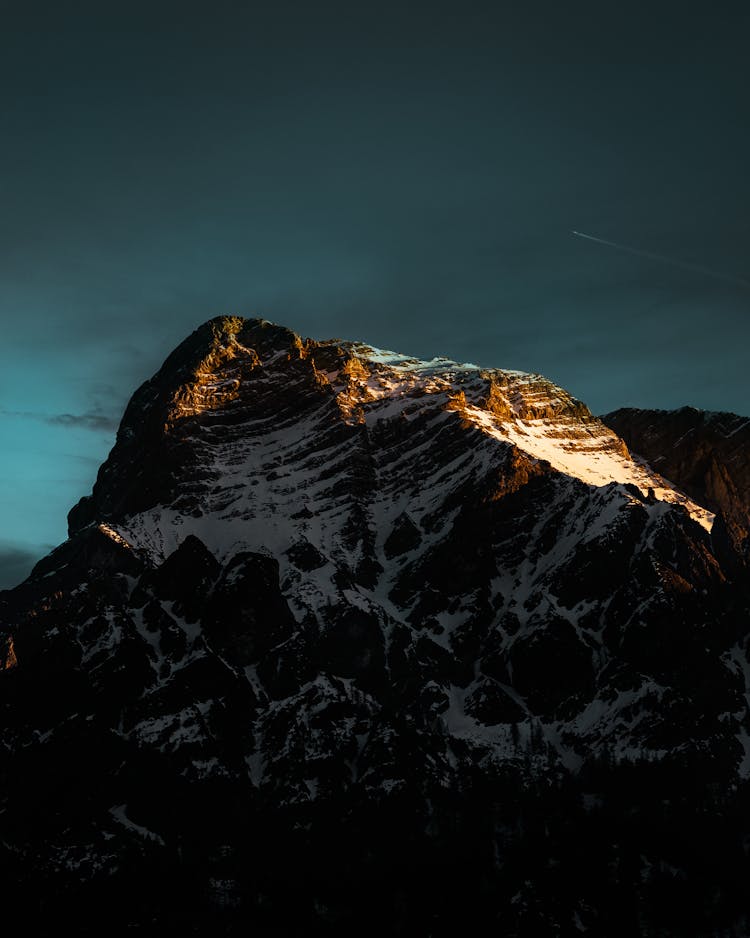 Picturesque View Of Rocky Mountain Peak At Sunrise