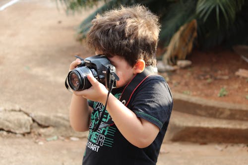 Kid Taking Photo with a Camera