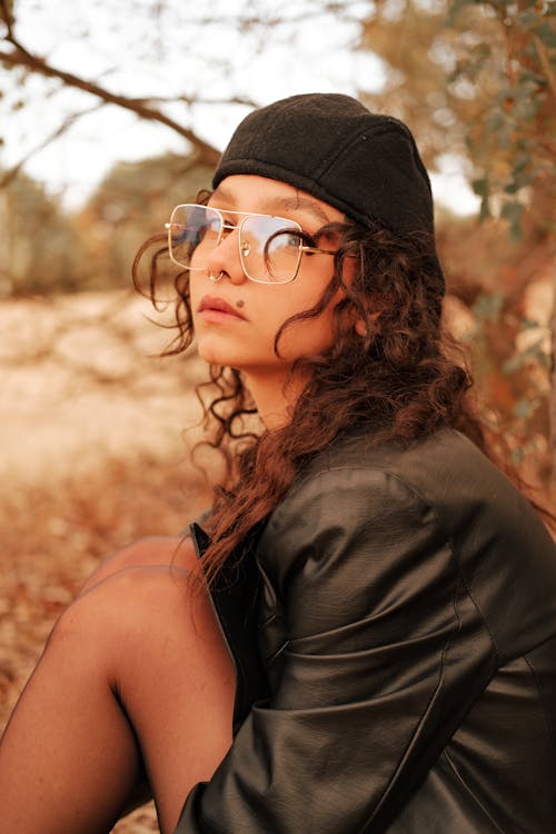 A Woman in Black Coat and with a Black Beret Hat