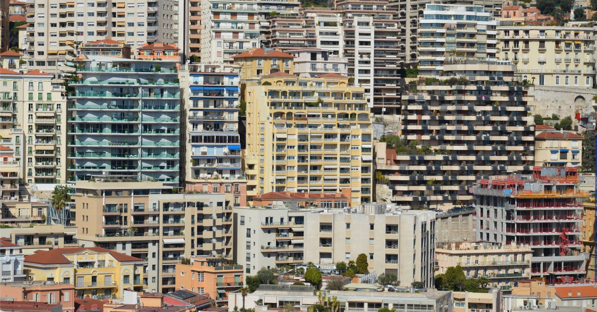 Dense cluster of modern high-rise buildings in a vibrant metropolitan cityscape.