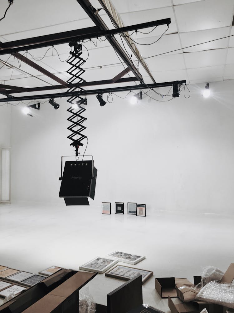 Exhibition Installation In A White Interior With Lamps