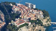 Breathtaking aerial shot of Prince's Palace of Monaco and Mediterranean coast.