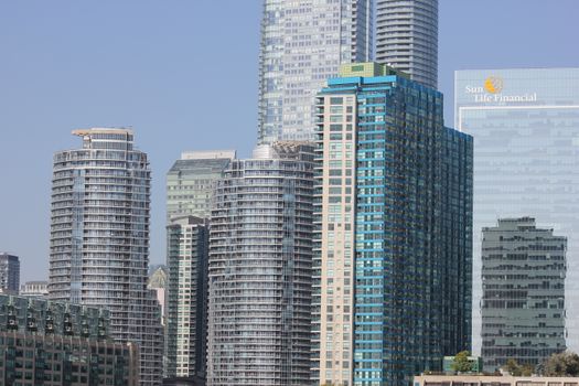 A stunning view of Toronto's skyscrapers with modern architecture under a clear blue sky.