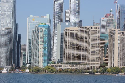 A vibrant view of Toronto's waterfront and modern skyscrapers, capturing urban life.