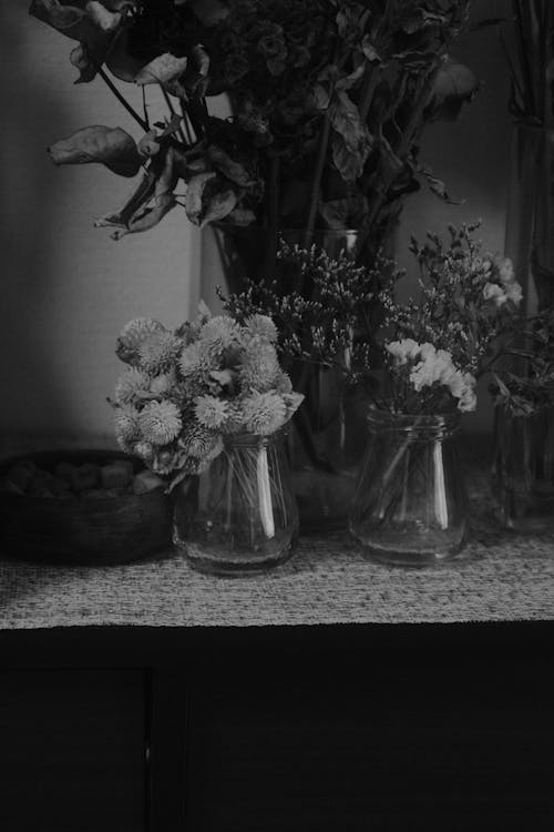 Black and White Photo of Flowers in Vases
