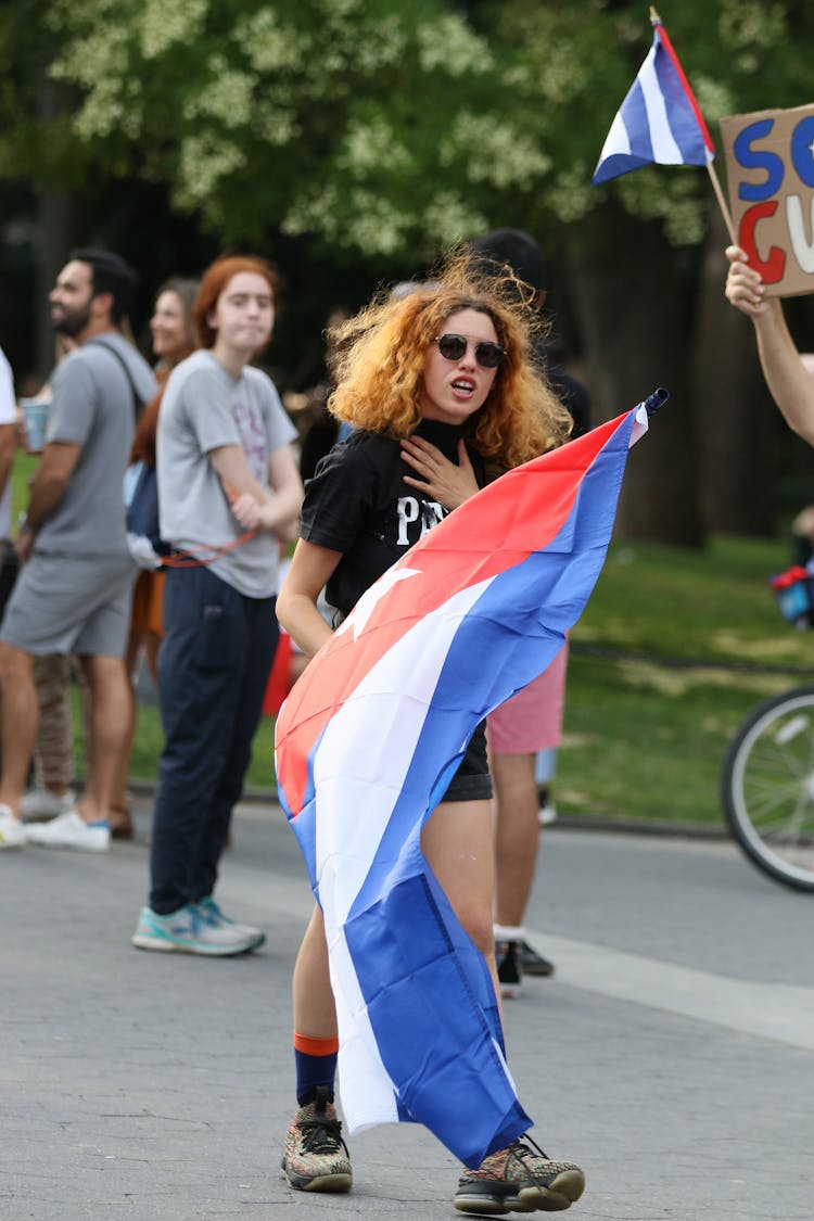 Young People Manifesting With Flags In A Park