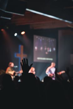 Energetic live performance with vibrant lighting and engaged audience.