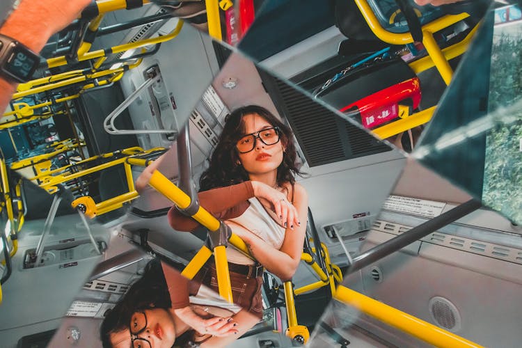 Woman Leaning On A Railing In Multiple Mirrors