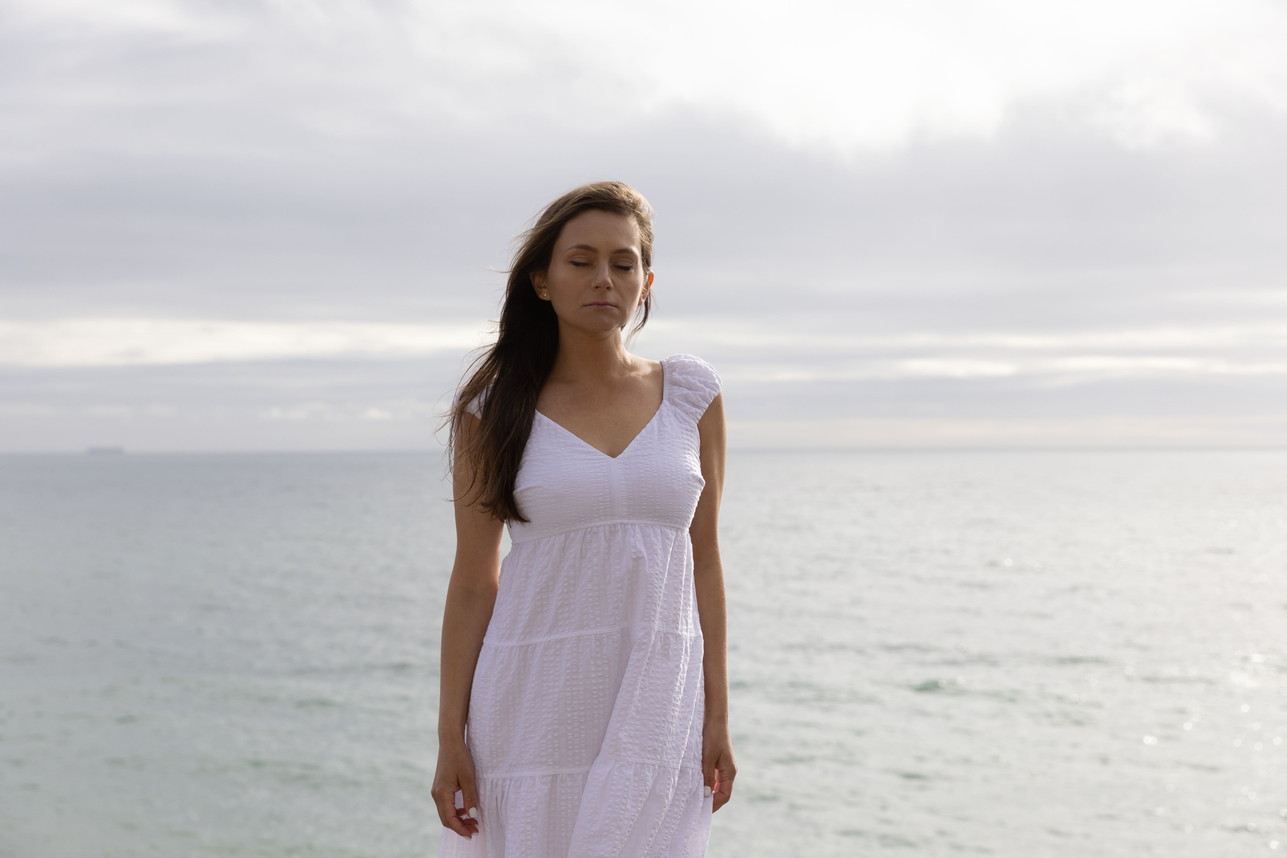 A Woman in White Dress Standing in Water · Free Stock Photo