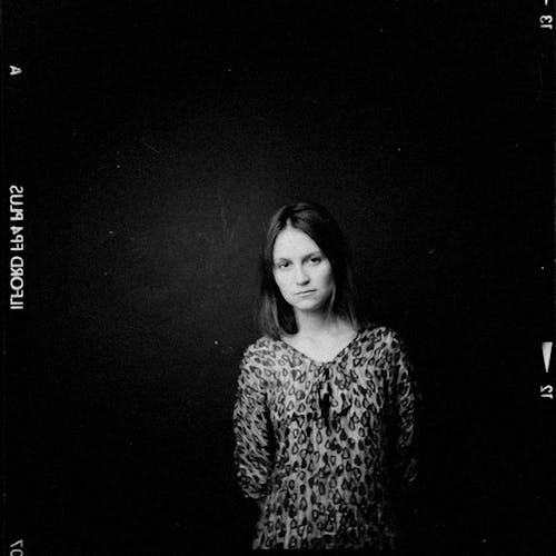 Black and White Photo of a Woman Wearing a Shirt with a Pattern