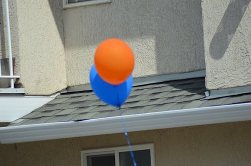Foto profissional grátis de azul, azul laranja, ballons