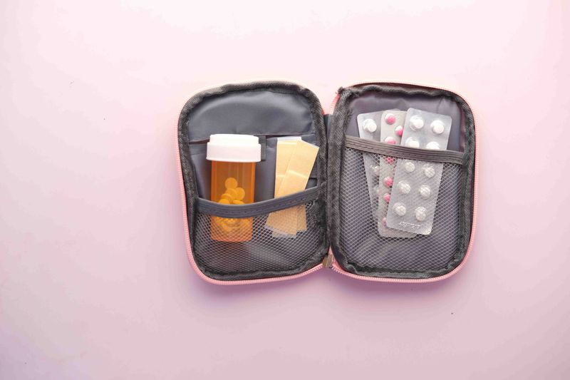Travel emergency kit open showing medications and supplies organized inside