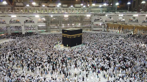 A Group of People Standing Near the Kaaba