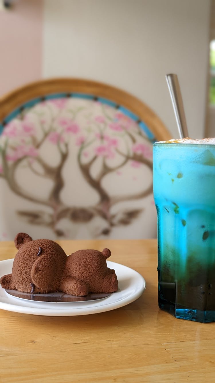 Bear Shape Chocolate Dessert And A Cup Of Iced Coffee