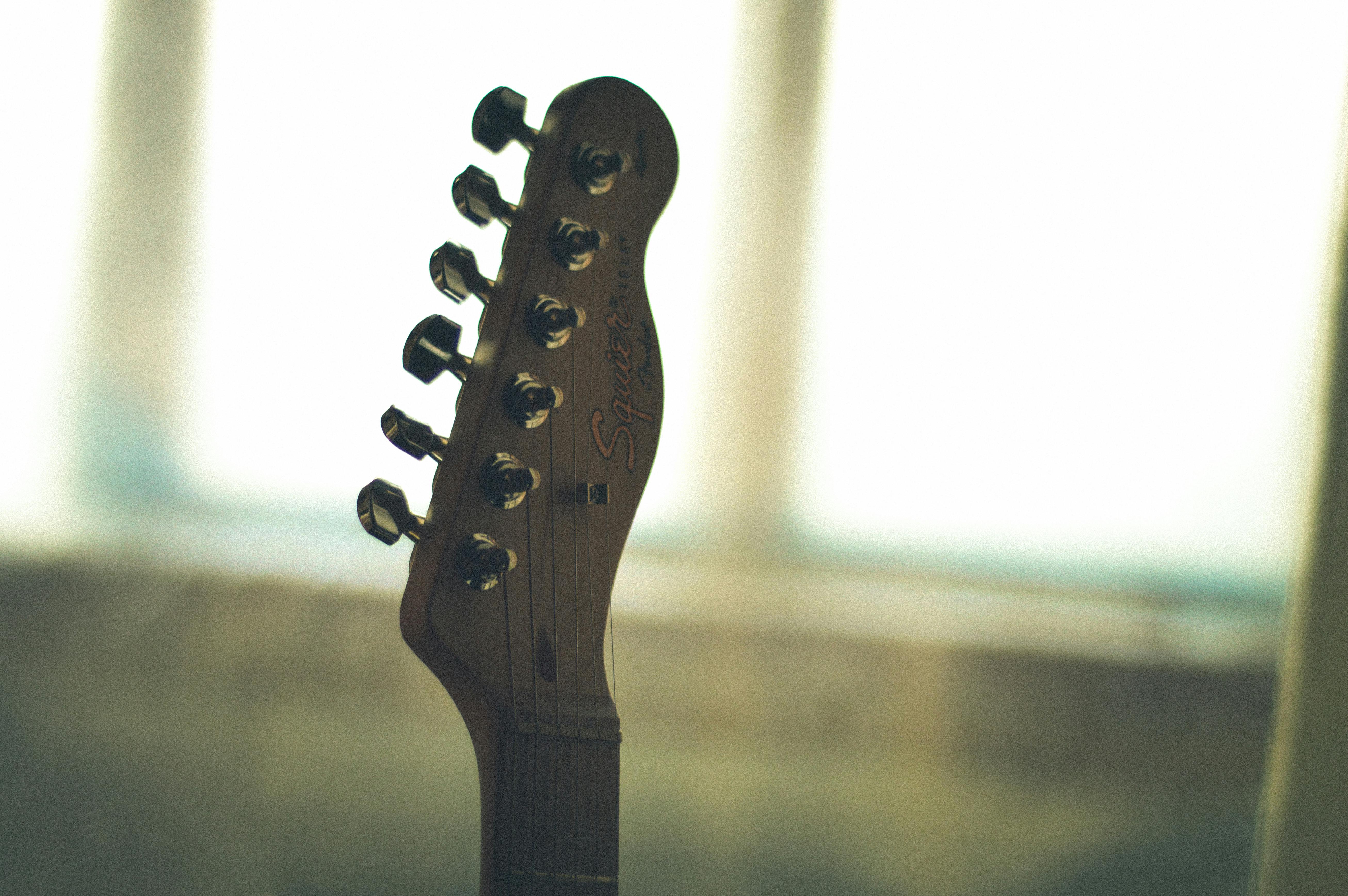 Close-Up Photography of Guitar Head Stock