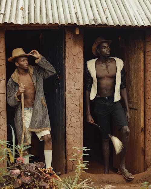 Men Standing in the Entrance of African Houses 