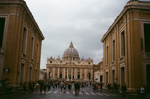 Free People Walking Outside St. Peter's Basilica in Vatican City Stock Photo