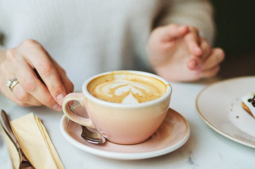 Free Photo of a Saucer with a Cup of Coffee and a Teaspoon Stock Photo