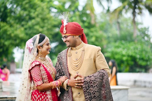 Free Photo of a Couple in Traditional Clothes Smiling at Each Other Stock Photo