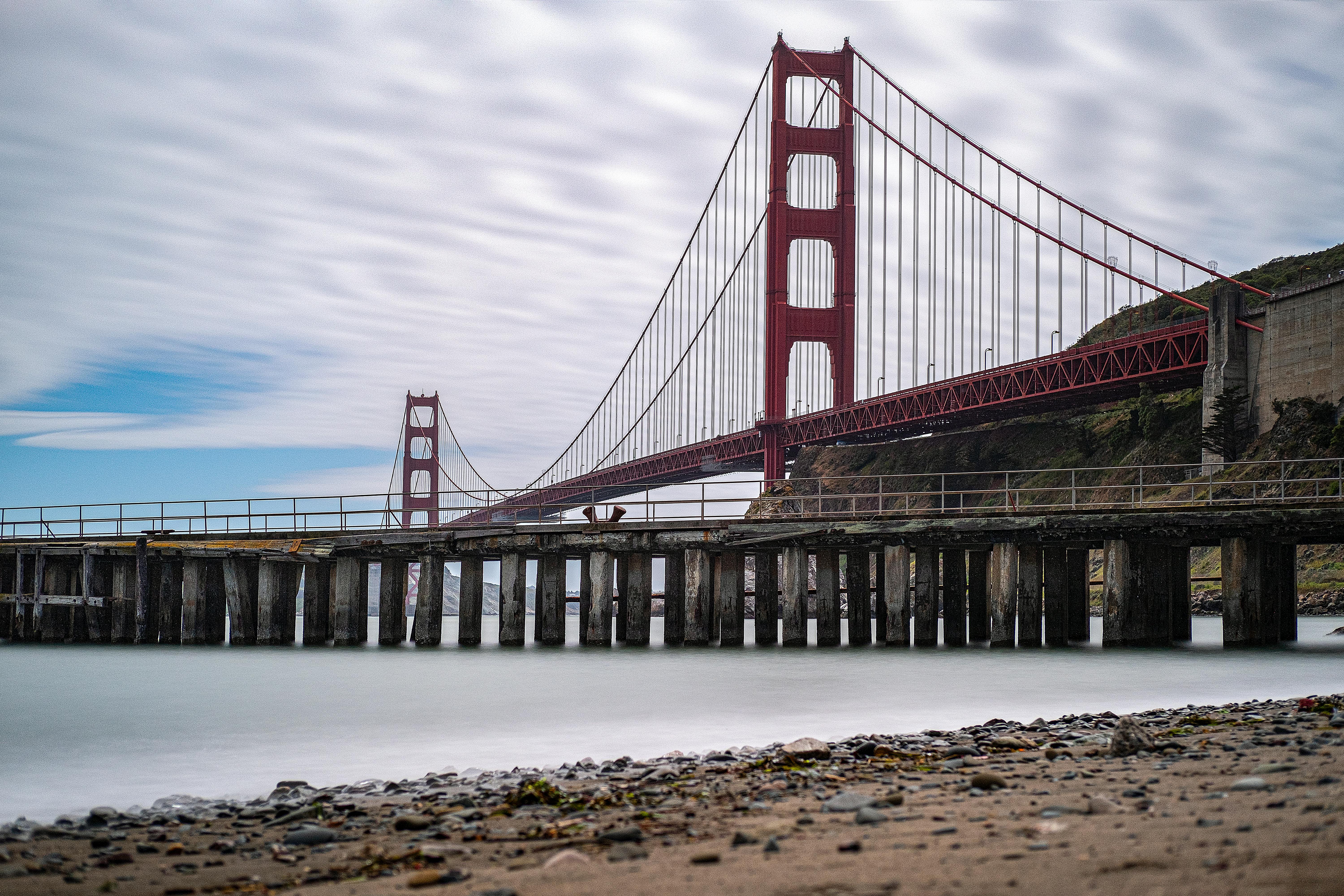 Stunning long exposure of the Golden Gate Bridge from the shore in San Francisco.