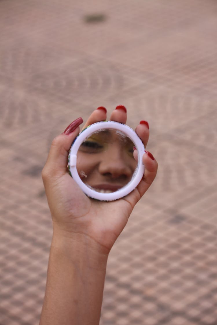 Person Holding A Hand Mirror