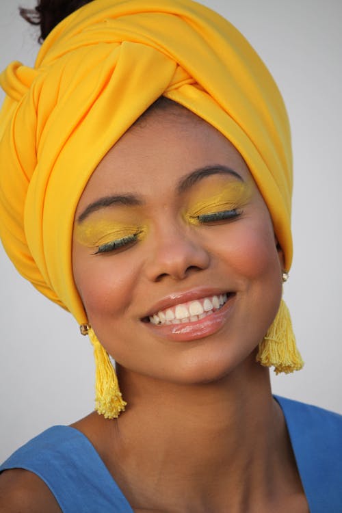 Close Up Photo of a Woman Wearing Yellow Headscarf