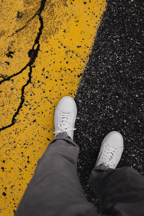 A Person in White Sneakers