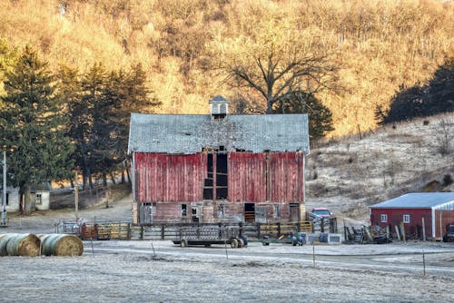 Red and Gray Wooden House on the Field