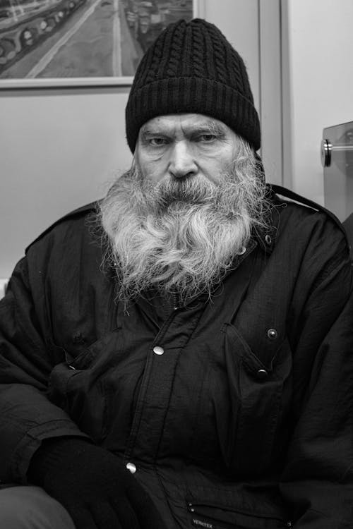 Monochrome Photo of an Elderly Man Wearing a Knitted Cap