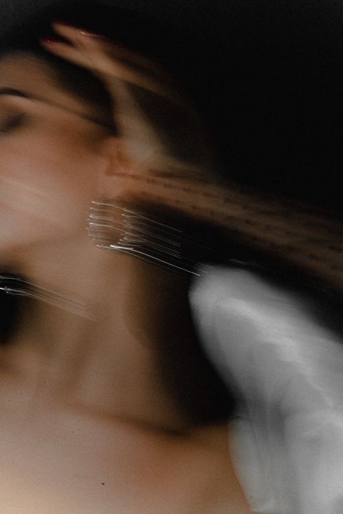 Free Artistic blurred motion photo of a woman in elegant fashion. Perfect for creative projects. Stock Photo