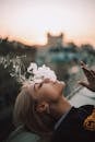 Woman Lying on a Roof of a Building and Smoking a Cigarette