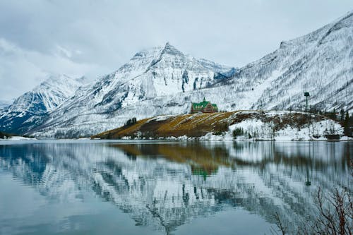 A Snow-Covered Mountain near the Lake