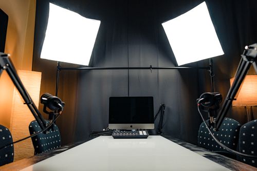 A podcast set with studio lighting — photo by dlxmedia.hu on Pexels