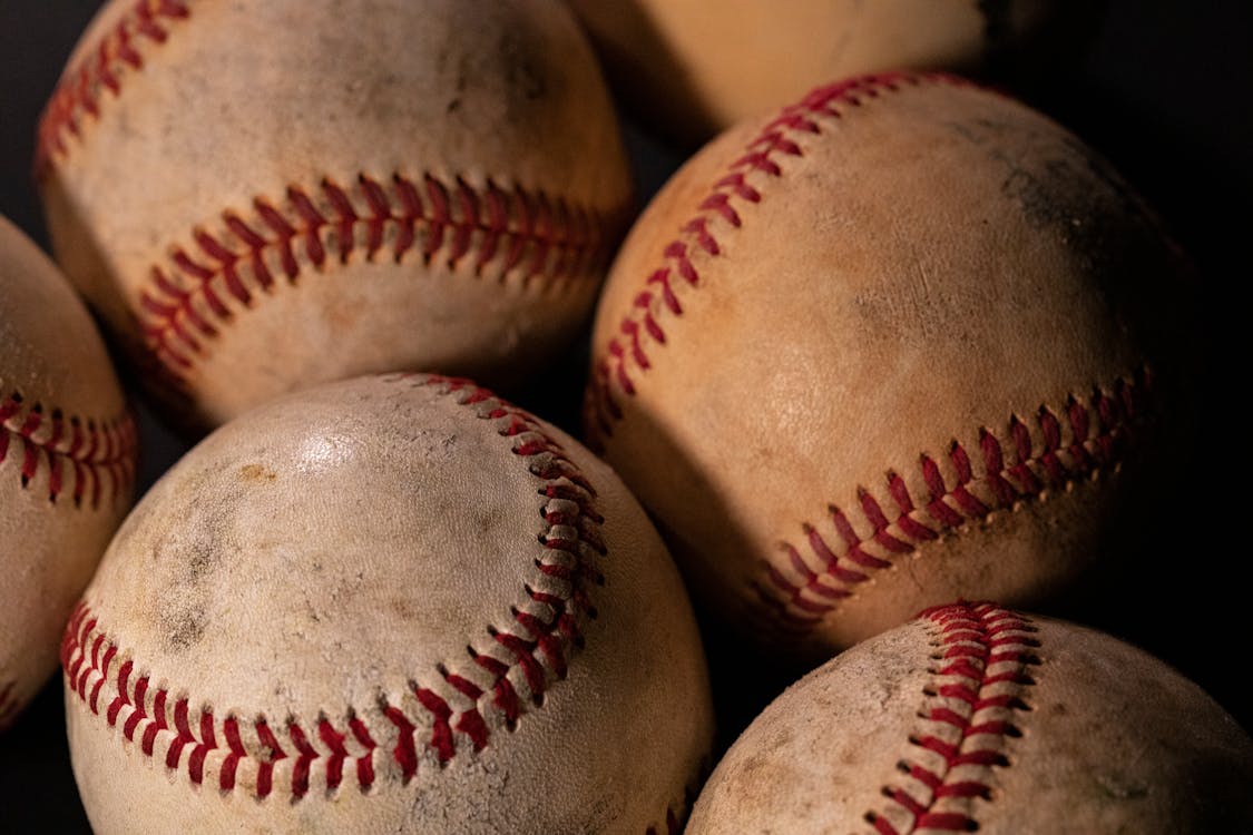 Free White and Red Baseball in Close Up Shot Stock Photo
