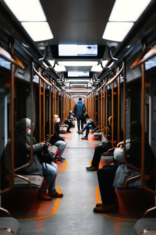 Free Interior of Subway Car with Passengers on Seats Stock Photo