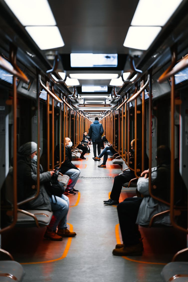 Interior Of Subway Car With Passengers On Seats