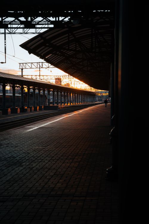 Free Sunset view of a deserted Moscow train station platform, capturing architectural beauty and evening light. Stock Photo
